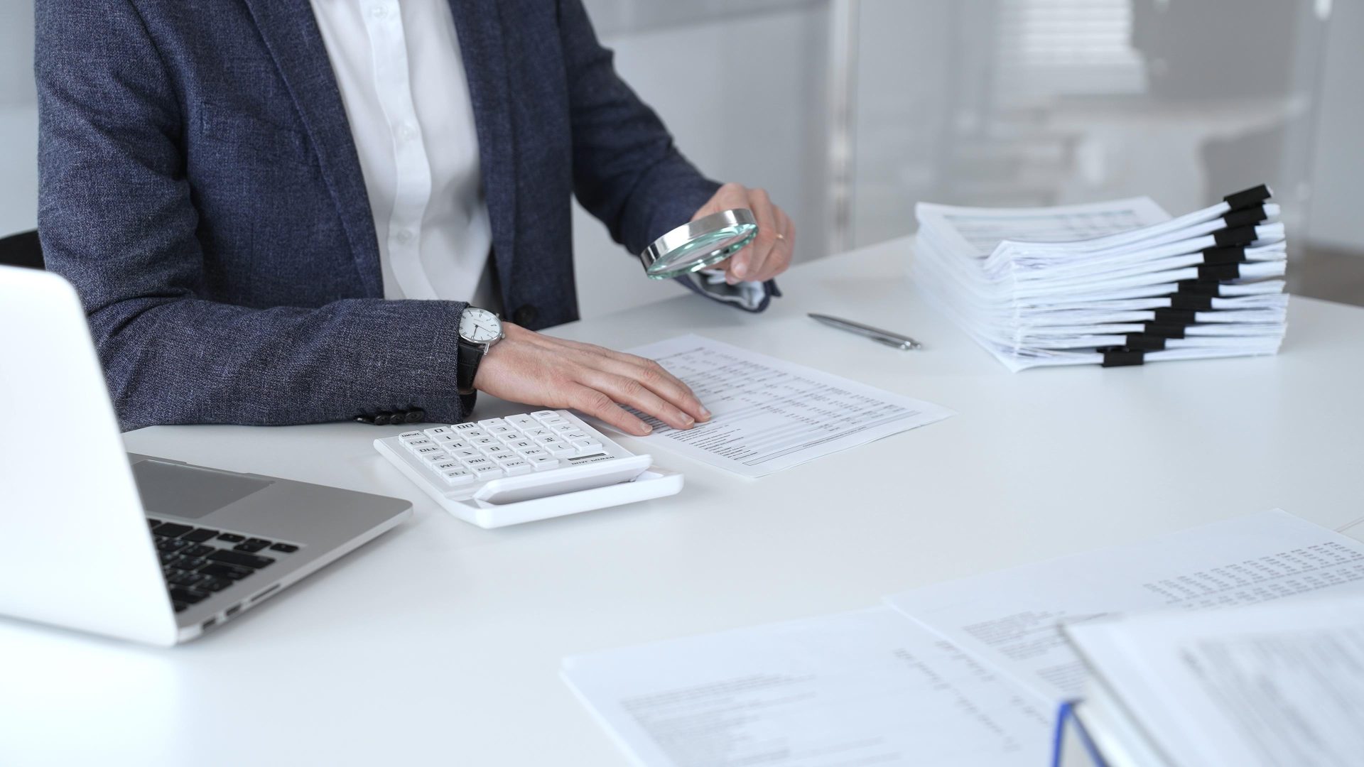 Business professional inspecting financial reports