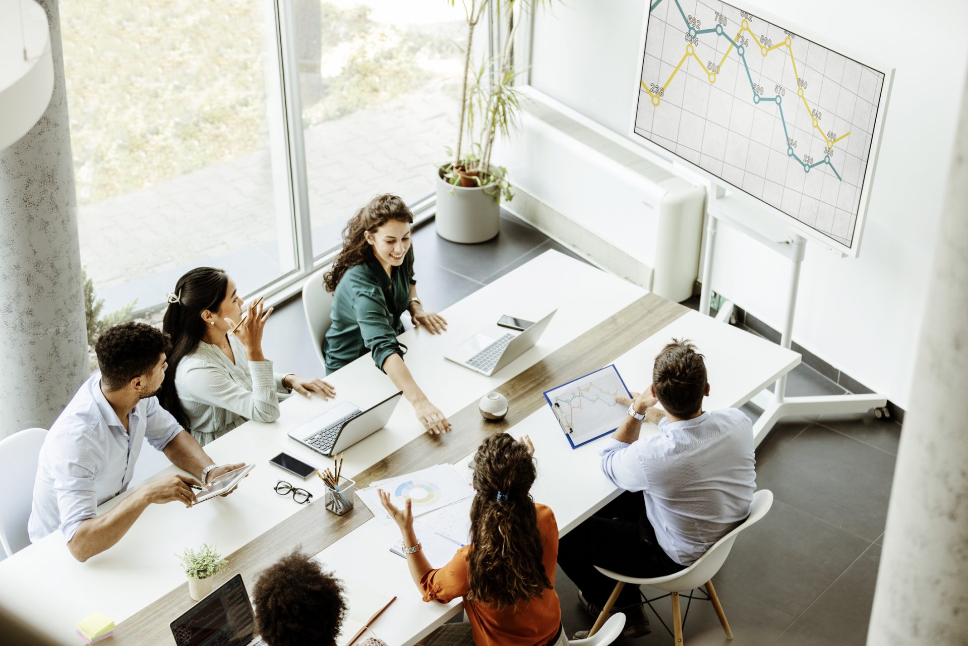 Business professionals in a modern tech-equipped meeting